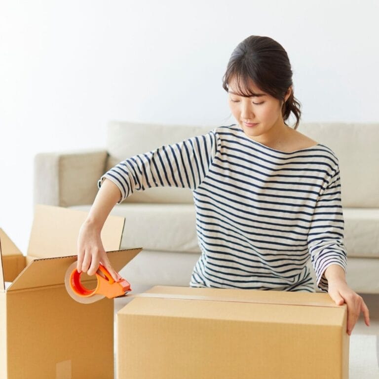 person packing for move