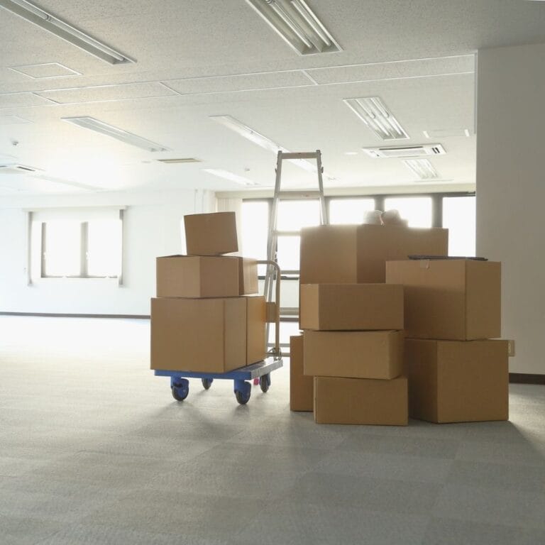 stacks of moving boxes in office space