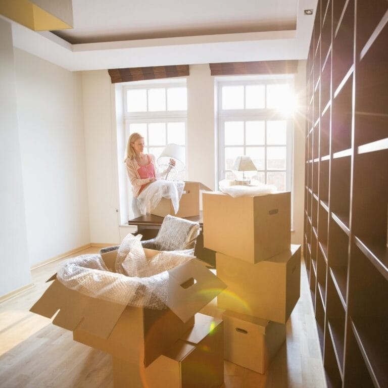 woman unpacking in new home
